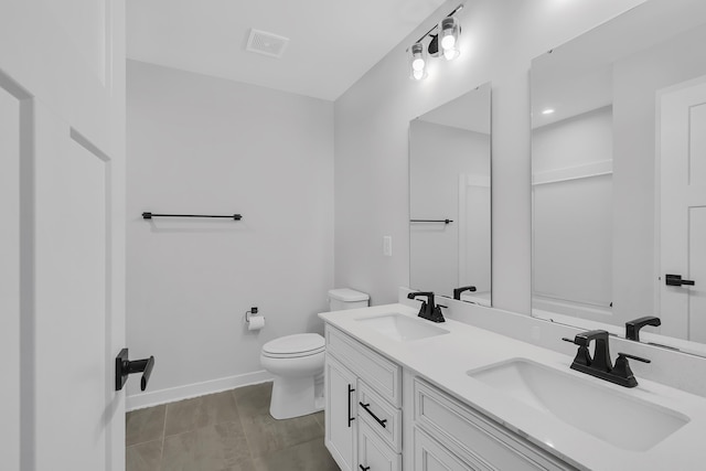 bathroom with toilet and vanity