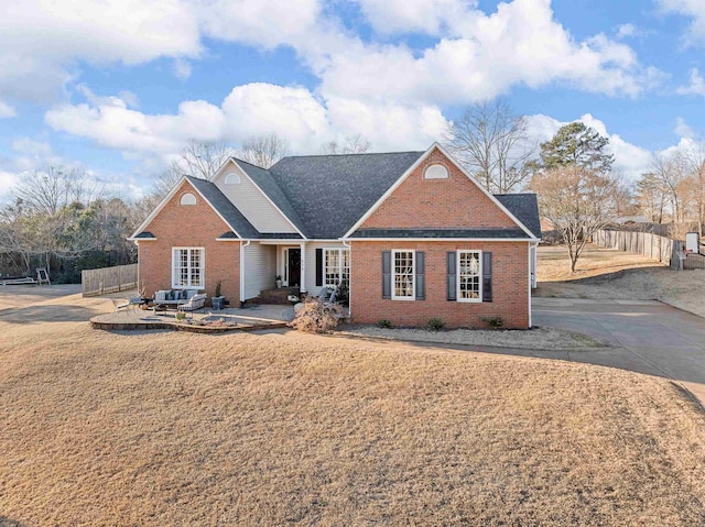 ranch-style home featuring a front yard