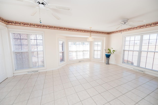 tiled spare room with plenty of natural light