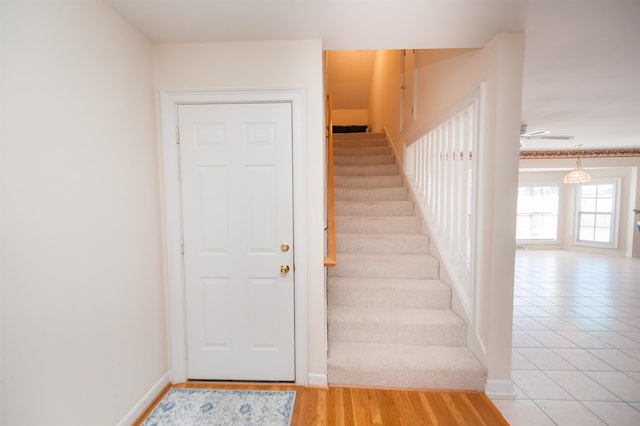 stairway with ceiling fan