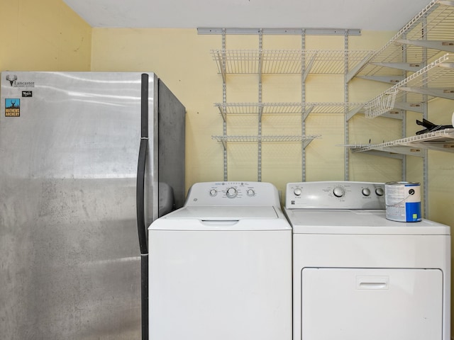 washroom with washer and clothes dryer