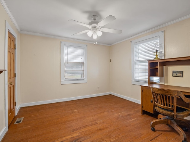 office area featuring ceiling fan, ornamental molding, and light hardwood / wood-style flooring