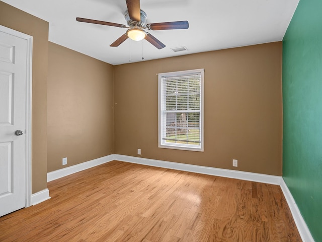 unfurnished room featuring ceiling fan and light hardwood / wood-style floors