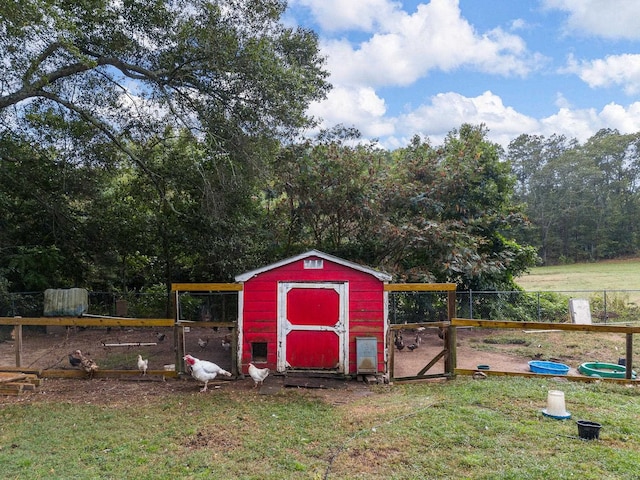 view of outbuilding featuring a lawn