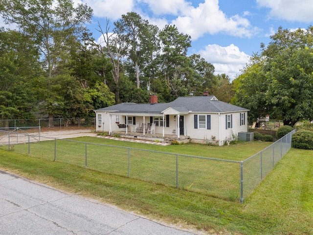 single story home featuring covered porch, a front yard, and central air condition unit