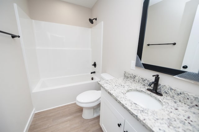 full bathroom featuring toilet, vanity, tub / shower combination, and hardwood / wood-style flooring