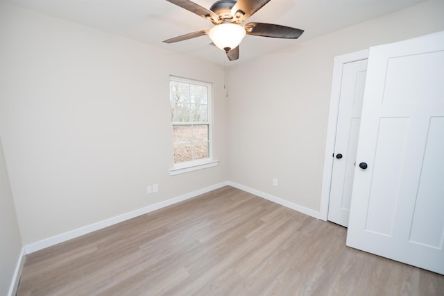 unfurnished bedroom featuring ceiling fan and light hardwood / wood-style floors