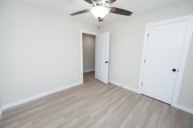 unfurnished bedroom featuring ceiling fan and light hardwood / wood-style flooring