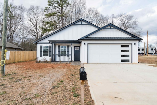 view of front of home featuring a porch and a garage