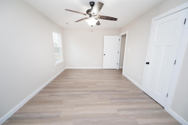 unfurnished bedroom featuring ceiling fan and light hardwood / wood-style flooring