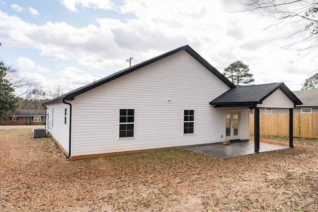 rear view of house featuring central AC unit, french doors, and a patio