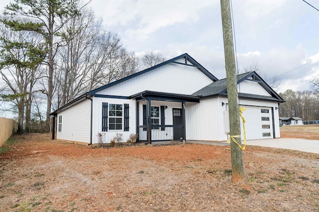 view of front of house with a garage and a porch