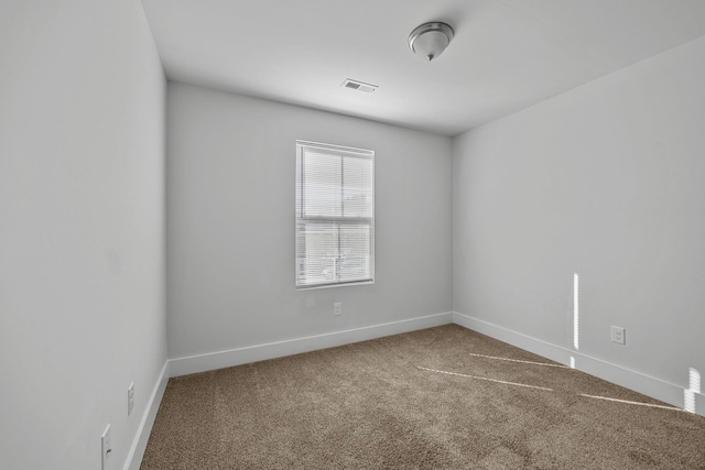 spare room with carpet floors