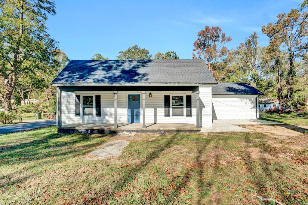 view of front of house with a front lawn and a porch