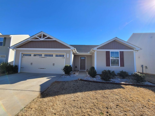 ranch-style house with board and batten siding, concrete driveway, and a garage