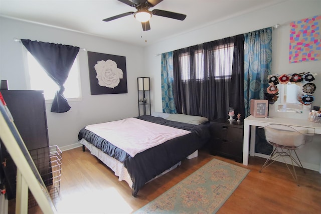 bedroom featuring ceiling fan and hardwood / wood-style floors