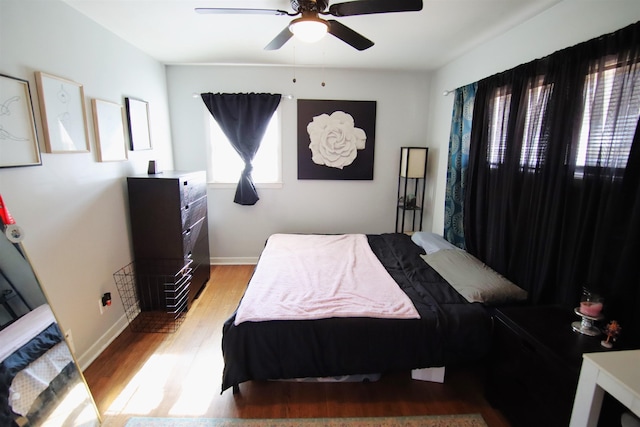 bedroom featuring ceiling fan and light hardwood / wood-style flooring