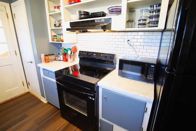 kitchen featuring decorative backsplash, light stone countertops, black appliances, and dark hardwood / wood-style flooring