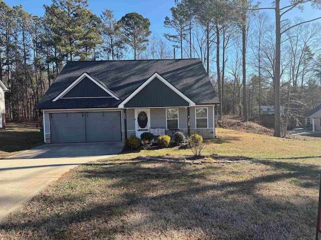 view of front of home featuring a front lawn, a porch, and a garage