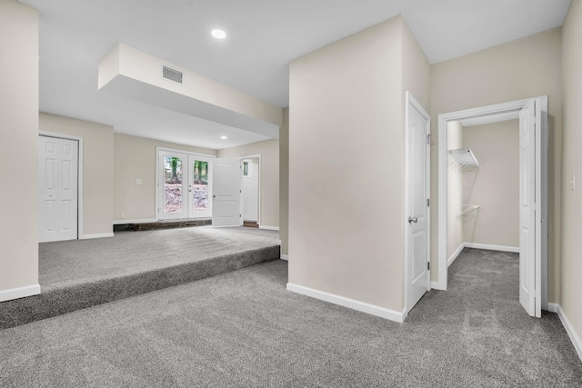 corridor featuring carpet floors and french doors