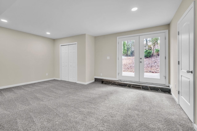 carpeted empty room with french doors