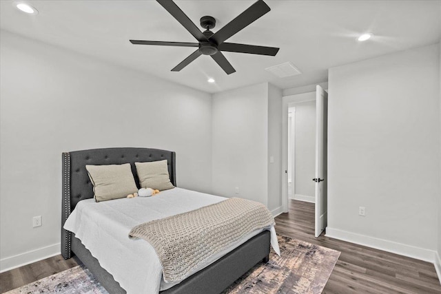 bedroom with ceiling fan and dark wood-type flooring