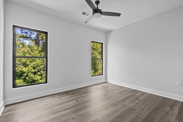 spare room featuring ceiling fan and hardwood / wood-style floors