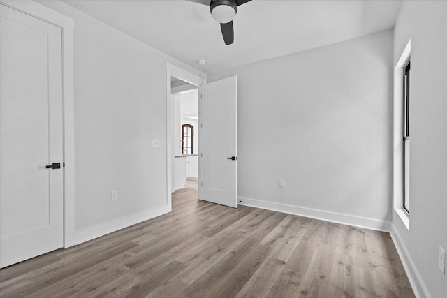 unfurnished bedroom featuring ceiling fan and light wood-type flooring