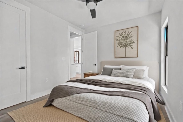 bedroom featuring ceiling fan and hardwood / wood-style floors