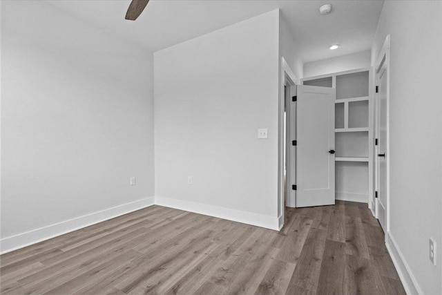 unfurnished room featuring ceiling fan and light wood-type flooring