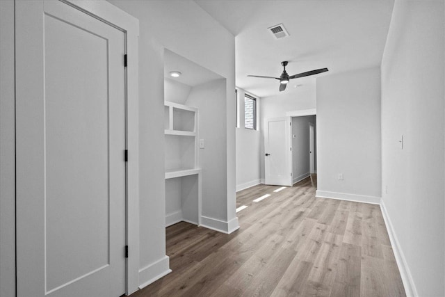 corridor featuring light hardwood / wood-style flooring