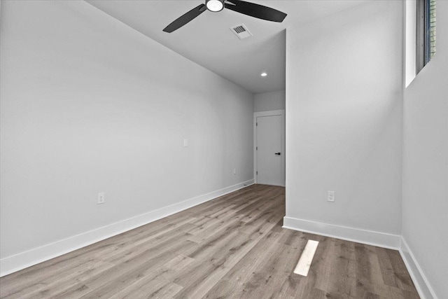 spare room featuring ceiling fan and light wood-type flooring