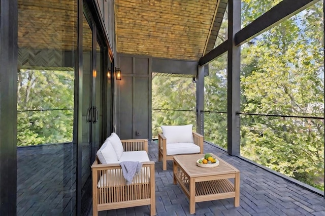 unfurnished sunroom with vaulted ceiling and a wealth of natural light