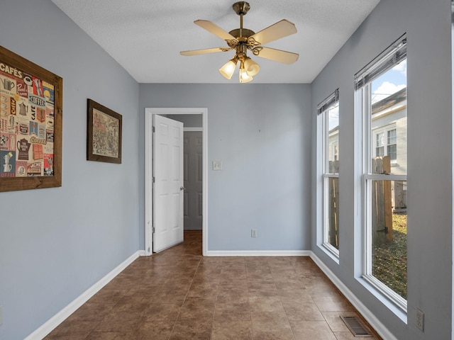 empty room with ceiling fan