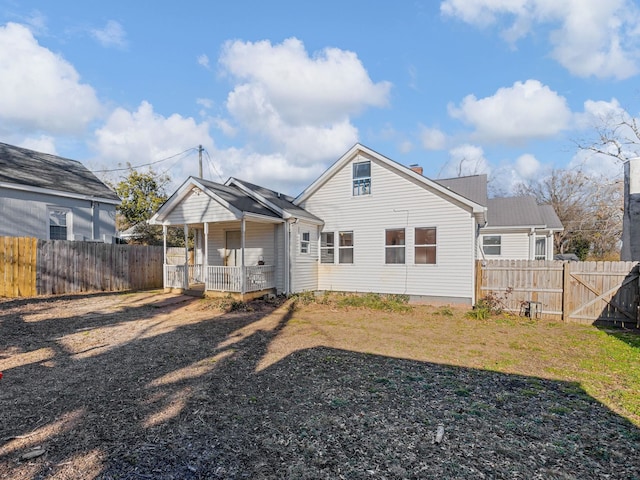 rear view of property with covered porch