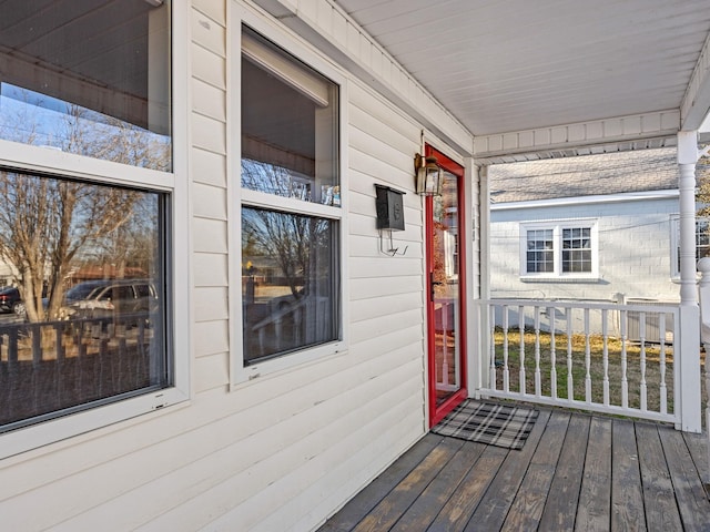 wooden deck featuring covered porch