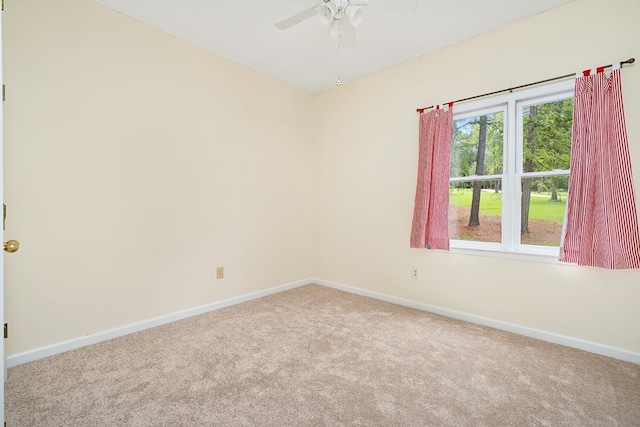 empty room with carpet floors and ceiling fan