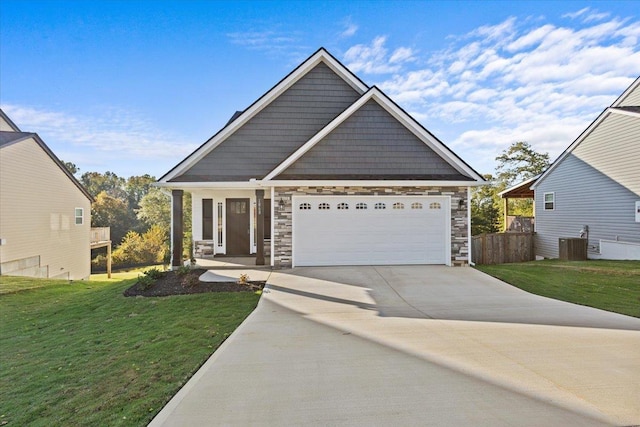 craftsman inspired home with a front lawn, central AC, and a garage