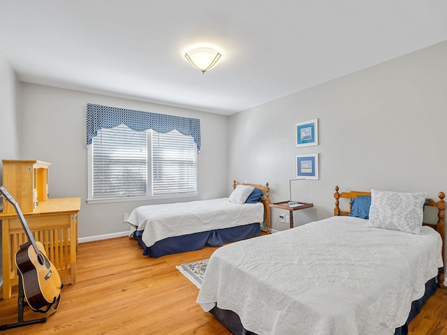 bedroom with hardwood / wood-style floors