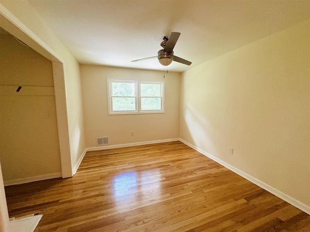 unfurnished bedroom featuring ceiling fan and light hardwood / wood-style flooring