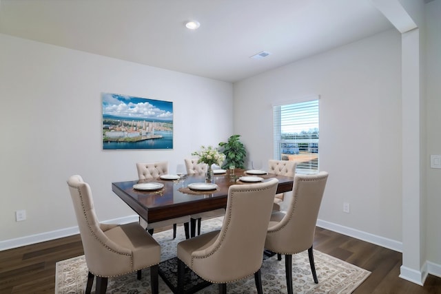 dining space featuring dark hardwood / wood-style flooring