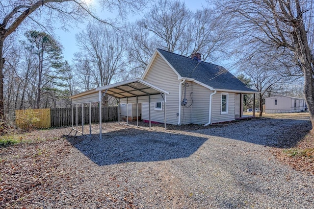 view of property exterior featuring a carport