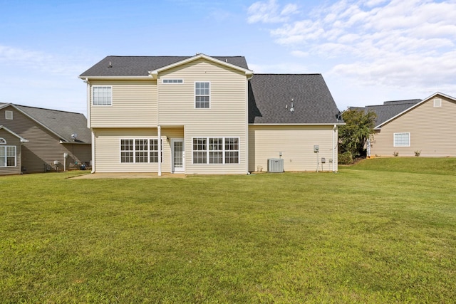 back of property featuring a patio area, cooling unit, and a lawn