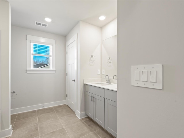 bathroom featuring recessed lighting, visible vents, vanity, baseboards, and tile patterned floors