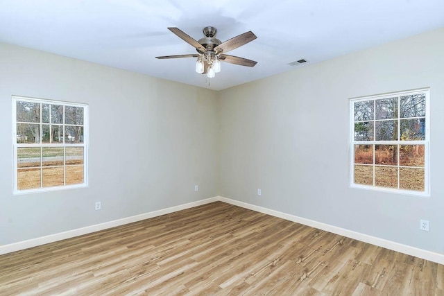 unfurnished room featuring light hardwood / wood-style floors and ceiling fan