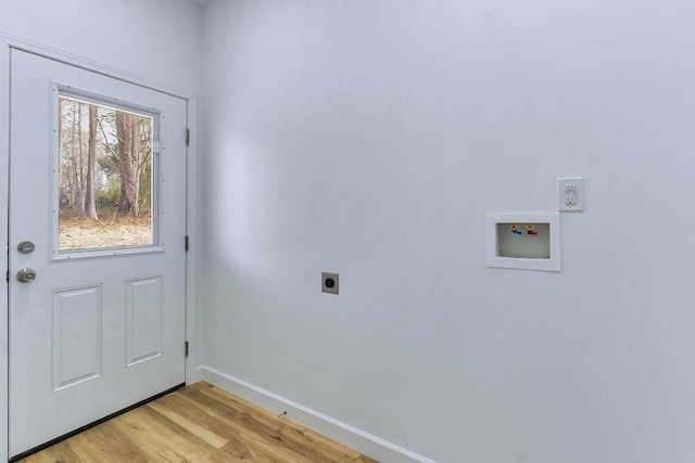 laundry area with hookup for a washing machine, light hardwood / wood-style flooring, and hookup for an electric dryer