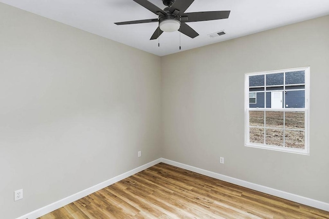 unfurnished room with ceiling fan and light hardwood / wood-style floors