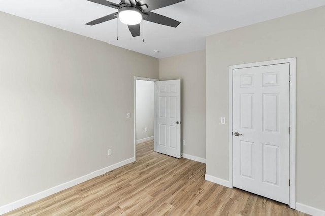 unfurnished bedroom featuring ceiling fan and light hardwood / wood-style floors