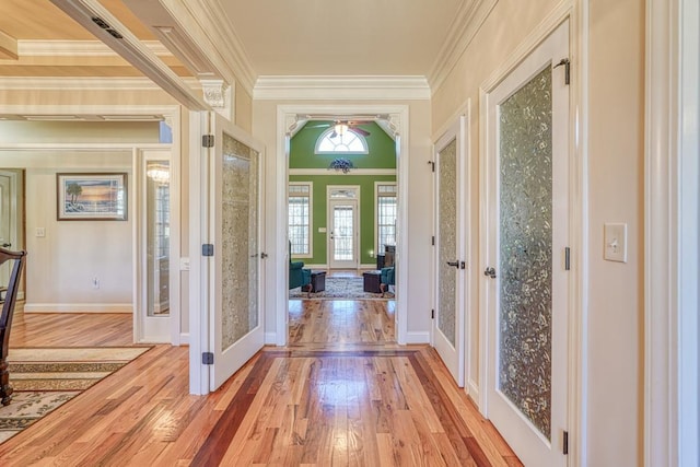 interior space featuring french doors, crown molding, and light hardwood / wood-style floors