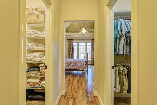 corridor featuring light hardwood / wood-style floors